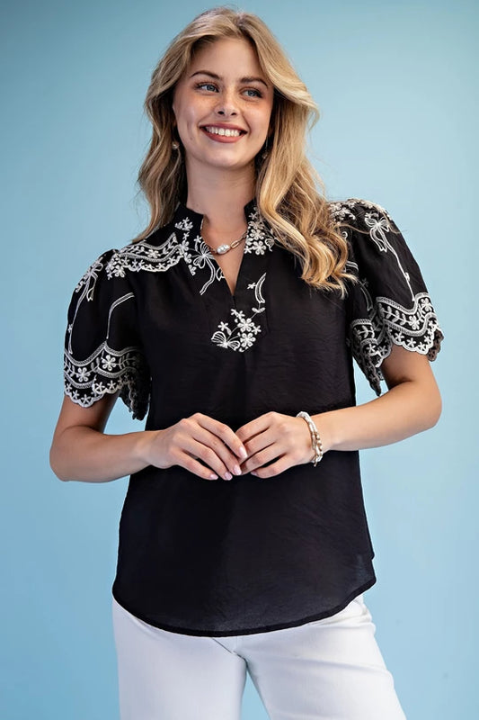 Embroidered Top with Scalloped Details and a Neckline Button Closure