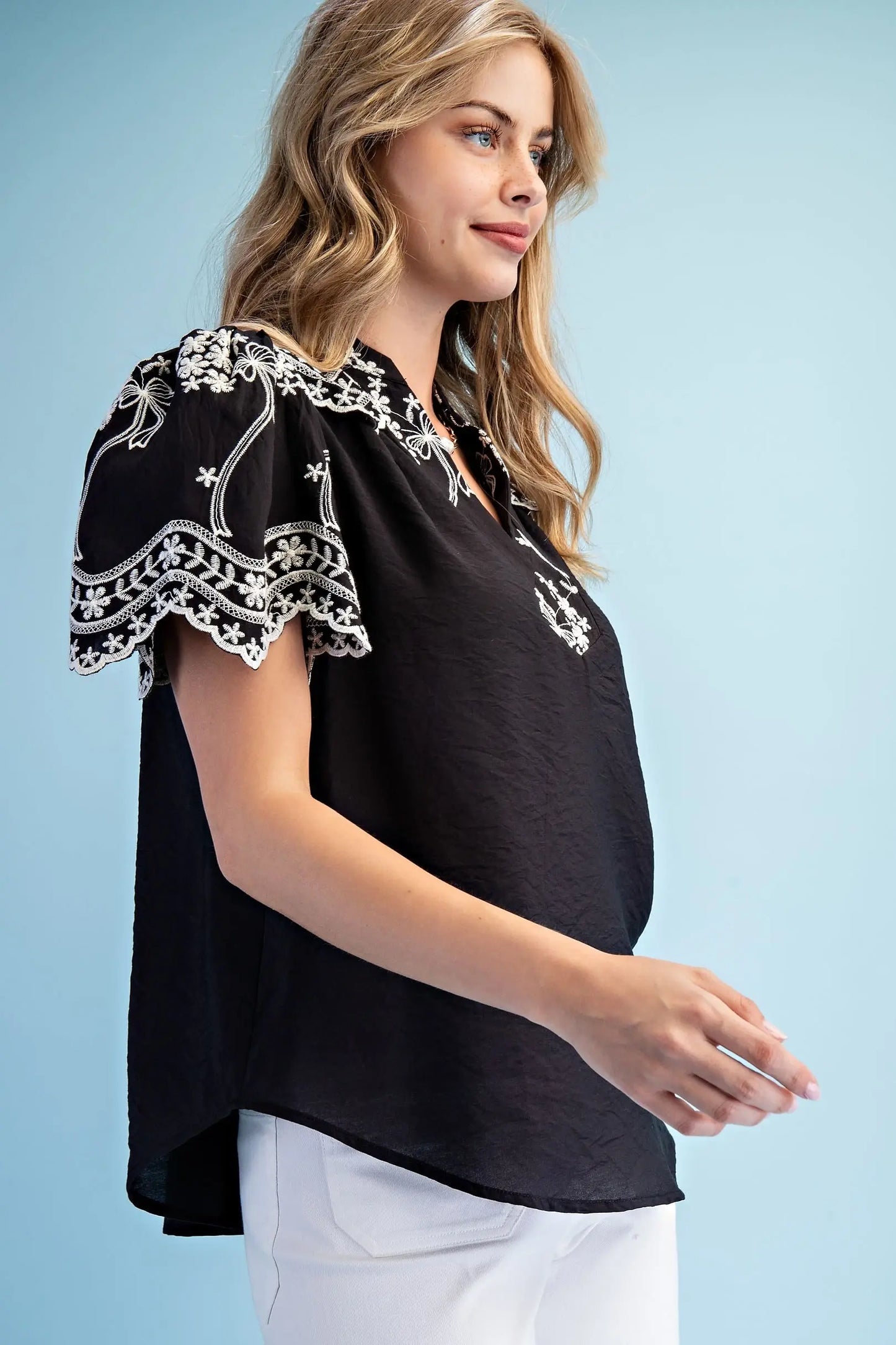 Embroidered Top with Scalloped Details and a Neckline Button Closure