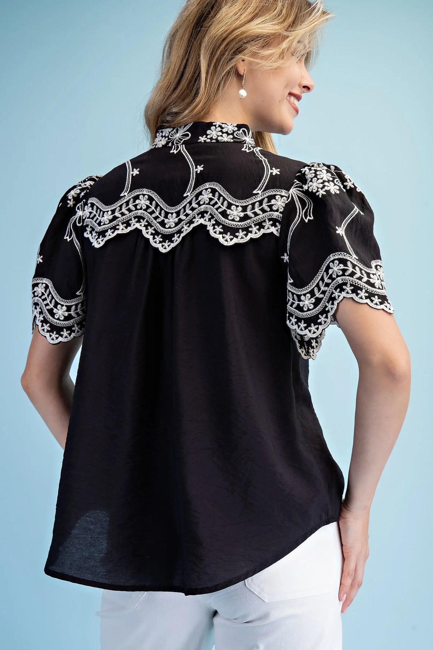 Embroidered Top with Scalloped Details and a Neckline Button Closure