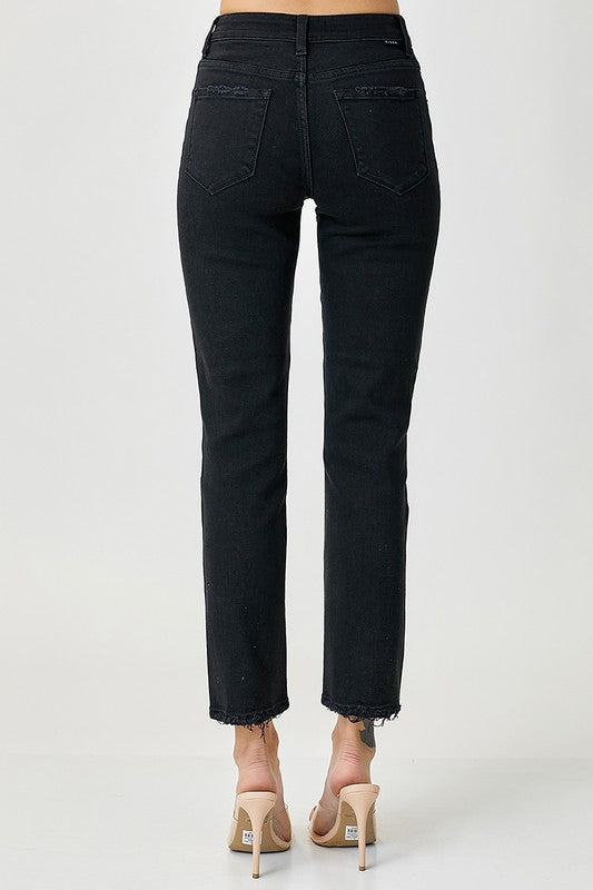 RISEN WOMAN IN BLACK JEANS